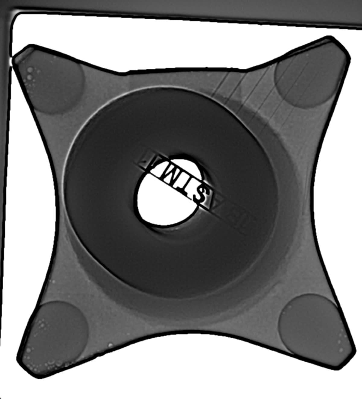 Radiograph — High-density component with central bore